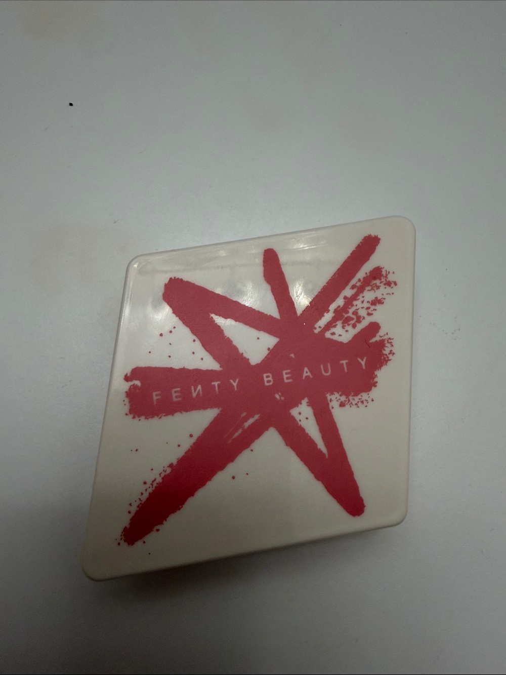 Fenty Beauty Highlighter Compact in Coral Pink